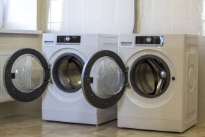 depositphotos 179249222 stock photo two open washing machines in