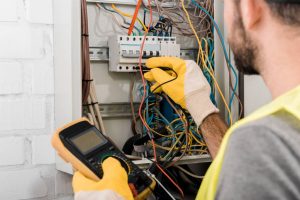 depositphotos 217089698 stock photo cropped image electrician checking electrical
