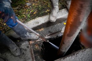 depositphotos 411564786 stock photo cleaning storm drains debris clogged